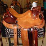 Wade - mule hide wrap, basket weave border, corner basket weave, 2-tone, stirrup leathers out and tooled, rope strap, cheyenne roll, floral conchos, fully tooled front and jockey