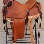 Wade -Santa Fe w scallop, fully toold seat,corner basket wv,mule hide,stirrup lthrs out_ tooled,floral conchos,bucking rolls,rawhide oxbows,wood post horn